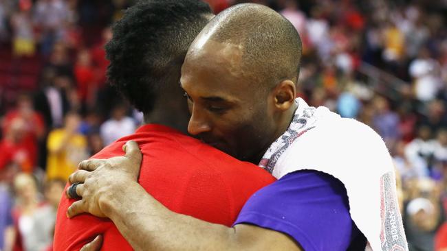 James Harden #13 of the Houston Rockets (L) greets Kobe Bryant #24 of the Los Angeles Lakers.