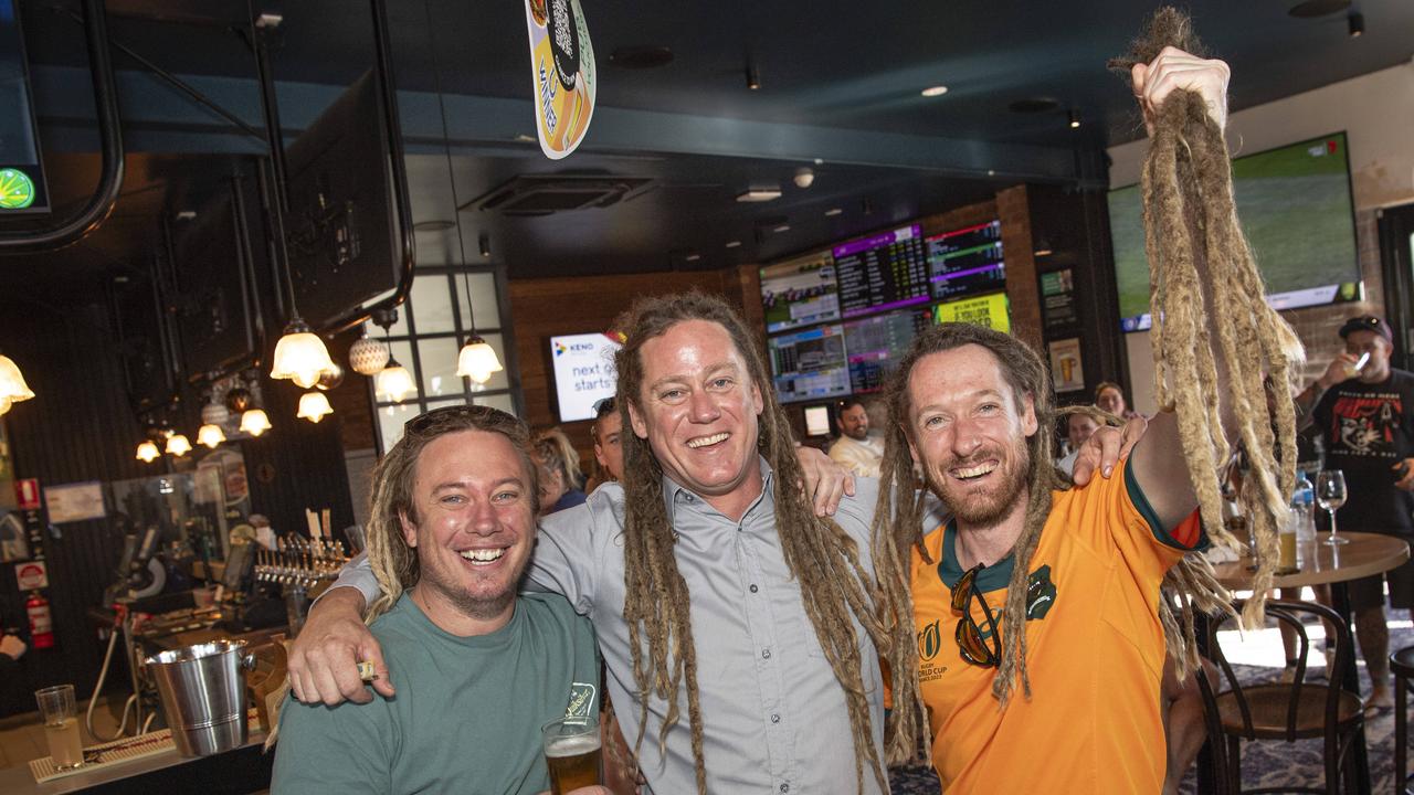 Joel Anderson (centre) with mates Jesse Briese (left) and Bradley Harrison as Joel's dreadlocks are cut off in a fundraiser for his daughter Charlise Anderson at the Blue Mountain Hotel, Saturday, November 23, 2024. Picture: Kevin Farmer