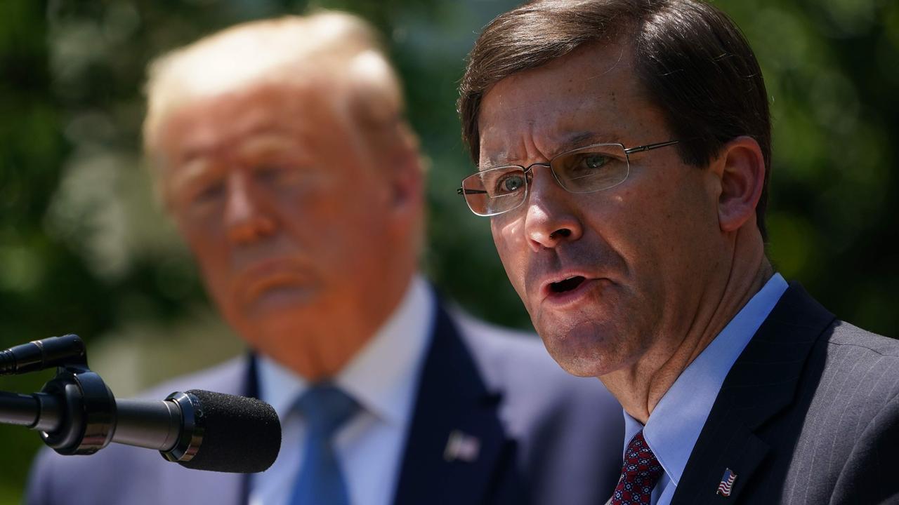 And Mr Trump with his then-defence secretary, Mark Esper. Picture: Mandel Ngan/AFP