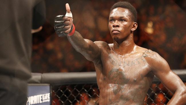 Israel Adesanya (right) taunts during the UFC 234 Middleweight Bout between Israel Adesanya of Nigeria v Anderson Silva of Brazil at Rod Laver Arena in Melbourne, Saturday, February 9, 2019. (AAP Image/Daniel Pockett) NO ARCHIVING, EDITORIAL USE ONLY