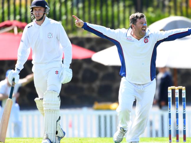 Grant McInerney (right) of Bayule reacts after bowling out Aaron Amos of Lalor stars during the DVCA grand final at Garvey oval, Bundoora, Melbourne, Saturday, March 14, 2020. DVCA grand final: Banyule v Lalor Stars. (AAP Image/James Ross) NO ARCHIVING