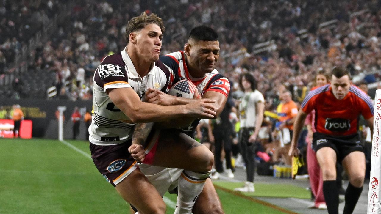 Daniel Tupou it with a Reece Walsh, shoulder charge in Las Vegas. Picture: NRL Photos