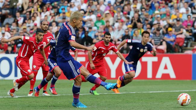 Keisuke Honda scores from the penalty spot.