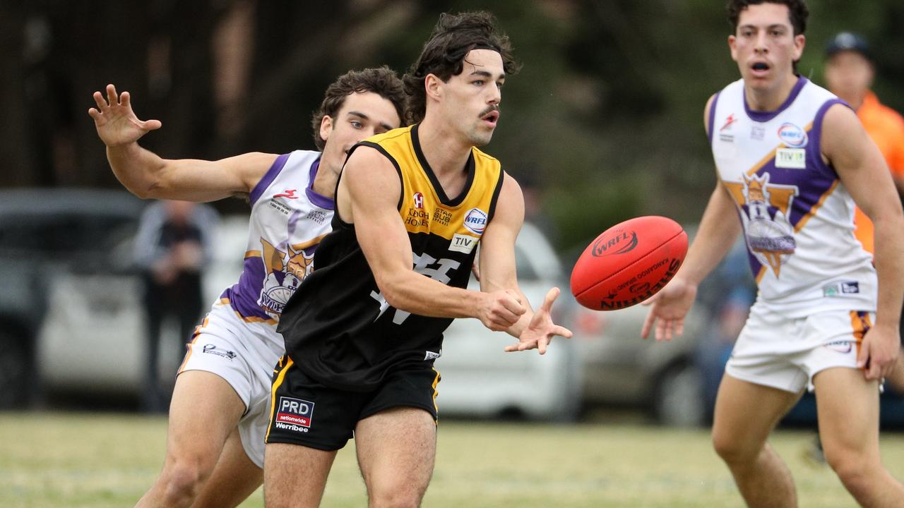 Connor Thar fires off a handball for Werribee Districts. Picture: Local Legends Photography