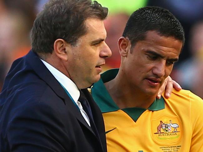 PORTO ALEGRE, BRAZIL - JUNE 18: Tim Cahill of Australia hugs head coach Ange Postecoglou after exiting the game during the 2014 FIFA World Cup Brazil Group B match between Australia and Netherlands at Estadio Beira-Rio on June 18, 2014 in Porto Alegre, Brazil. (Photo by Cameron Spencer/Getty Images)