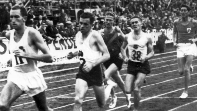 Herb Elliott leads the field during the third lap of his world record-breaking mile in Dublin. Following Elliott is Merv Lincoln Picture: AP