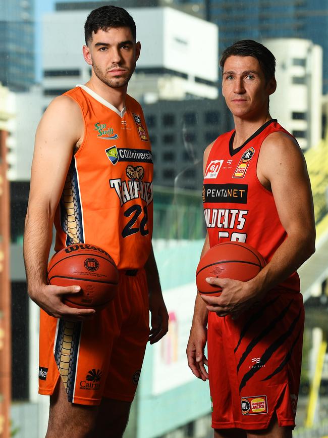 Fabijan Krslovic (left) of the Cairns Taipans and Damian Martin of the Perth Wildcats pose for a photograph during an NBL Finals Series media event in Melbourne, Monday, February 17, 2020. (AAP Image/James Ross)