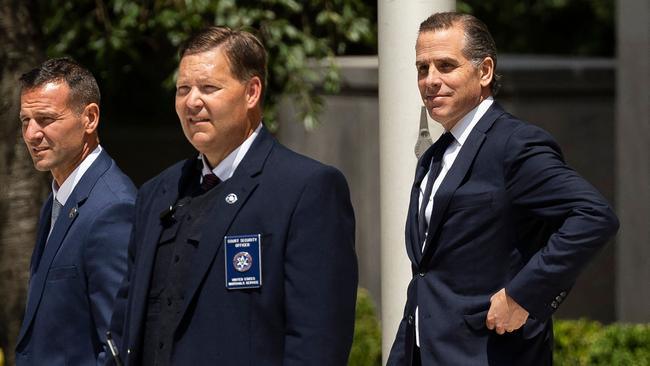 Hunter Biden (R), son of US President Joe Biden, leaves the J. Caleb Boggs Federal Building in Wilmington, Delaware.