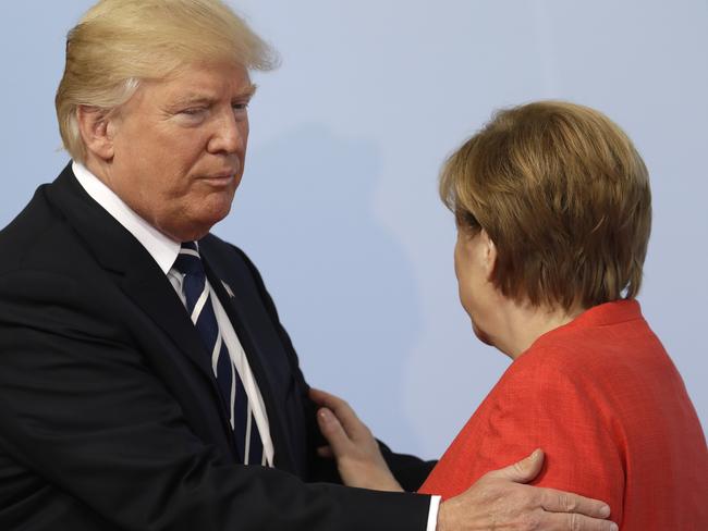 President Trump arrives and meets German Chancellor Merkel at the opening of the summit. Picture; Photo/Michael Sohn