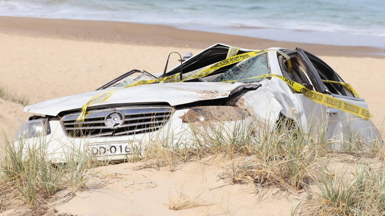 Car plummets 50m over cliff onto beach