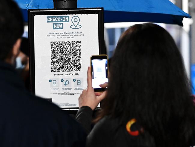 MELBOURNE, AUSTRALIA - JUNE 25:  Spectators use their phones to scan the QR code to check in before entering the stadium ahead of game three of the NBL Grand Final Series between Melbourne United and the Perth Wildcats at John Cain Arena, on June 25, 2021, in Melbourne, Australia. (Photo by Quinn Rooney/Getty Images)