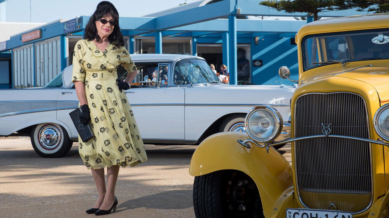 Andrea Handford with two classic cars ahead of the Maroubra Beach Hop Charity Car Show. picture: Flavio Brancaleone