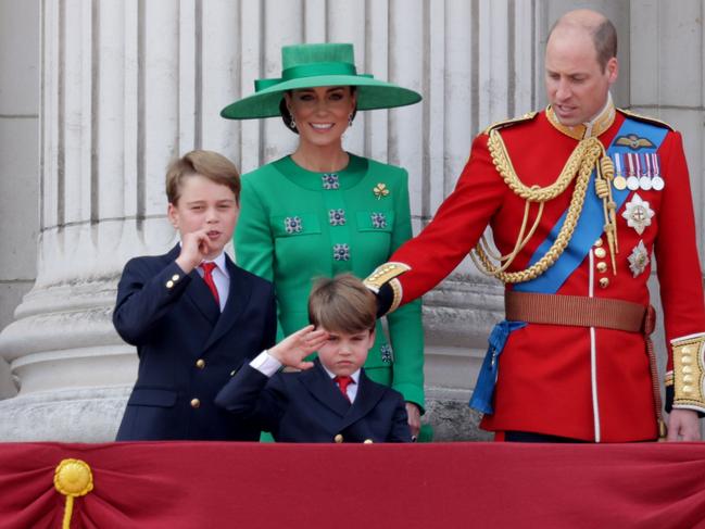 Prince Louis gives a salute on the balcony of Buckingham Palace and he and his family watch the flypast. Picture: Chris Jackson/Getty Images