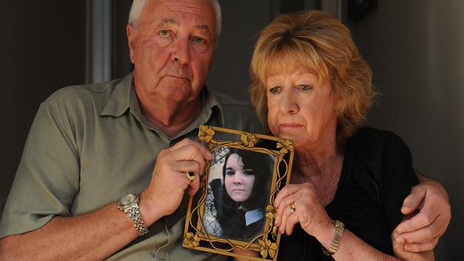 Carmel and Brian Russell with a photo of their daughter Natalie Russell.