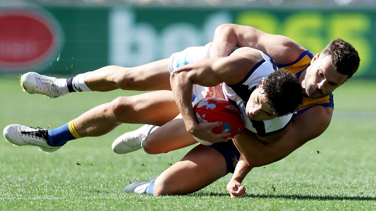 Tyson Stengle is tackled into the turf by Josh Rotham, which resulted in an injury to the Cat. Picture: Getty Images