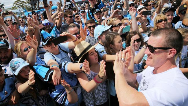 Paul Gallen celebrates Cronulla’s premiership with Sharks fans.