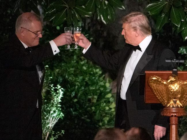 Mr Trump and Mr Morrison toast at the Official State Dinner in Washington. Picture: AFP