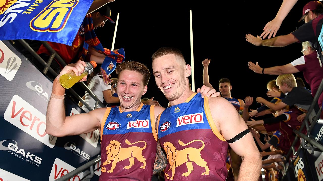 Dayne Beams and Alex Witherden depart after a win at the Gabba.