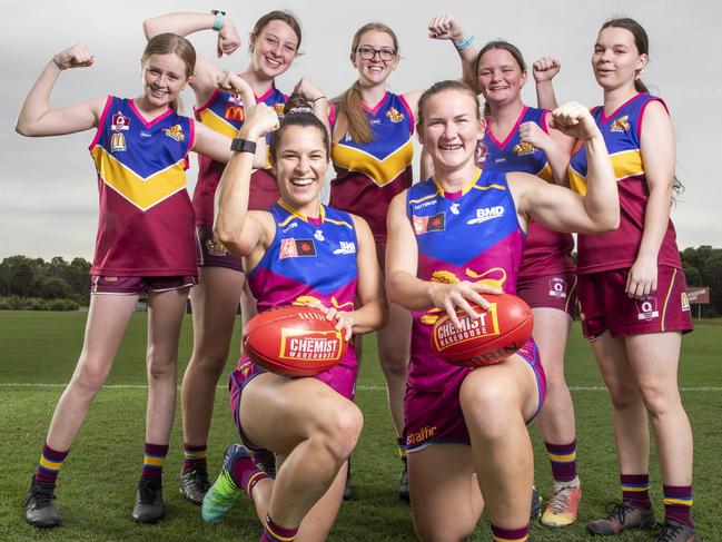 Lions AFLW players Ally Anderson and Shannon Campbell with Moreton Bay Lions juniors Jaydah, 13, Chaye, 15, and Kirra Barrie, 16, and Katie and Bailey Rooks, both 17, at the Moreton Bay Sports Complex at Burpengary where Brisbane will take on Essendon this weekend. Picture: Lachie Millard