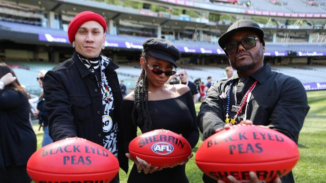 Black Eyed Peas members Taboo (left) and apl.de.ap with singer Jessica Reynoso ahead of their performance at the Grand Final. Picture: AAP Image/David Crosling