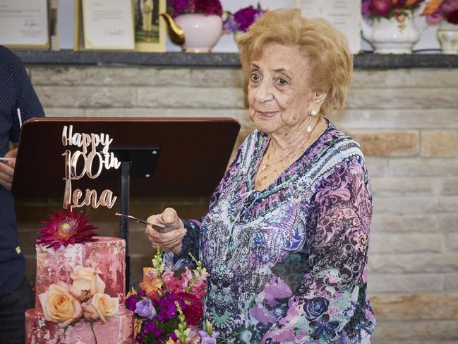 Holocaust survivor Lena Goldstein cuts the cake at her 100th birthday celebrations in Sydney.  Picture: Lauren Trompp