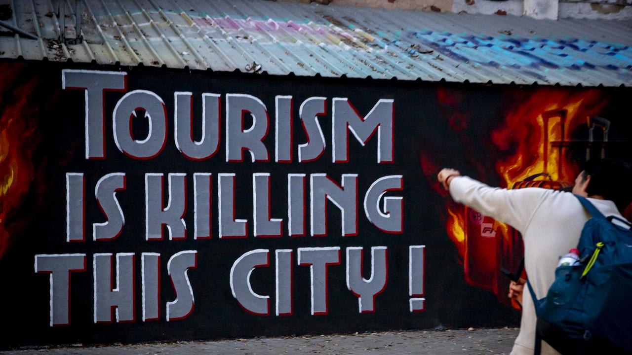 The graffiti says it all. Picture: Albert Llop / NurPhoto / NurPhoto via AFP