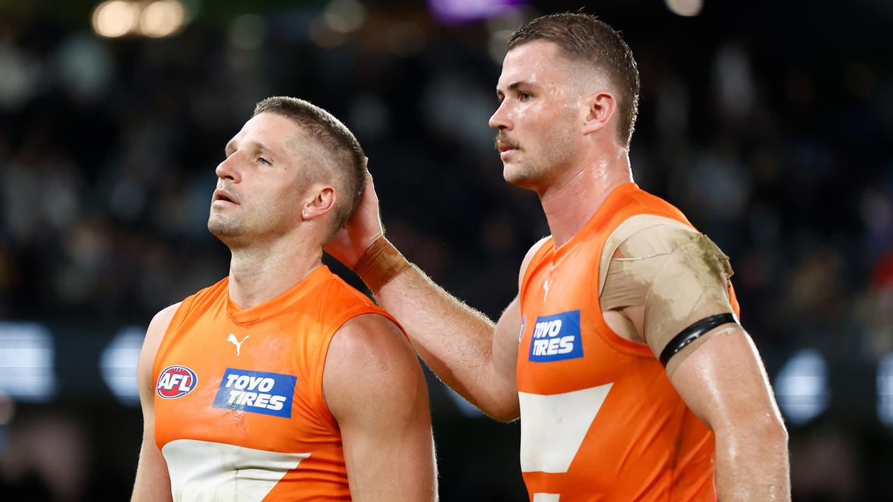 MELBOURNE, AUSTRALIA - APRIL 20: Jesse Hogan (left) and Kieren Briggs of the Giants look dejected after a loss during the 2024 AFL Round 06 match between the Carlton Blues and the GWS GIANTS at Marvel Stadium on April 20, 2024 in Melbourne, Australia. (Photo by Michael Willson/AFL Photos via Getty Images)