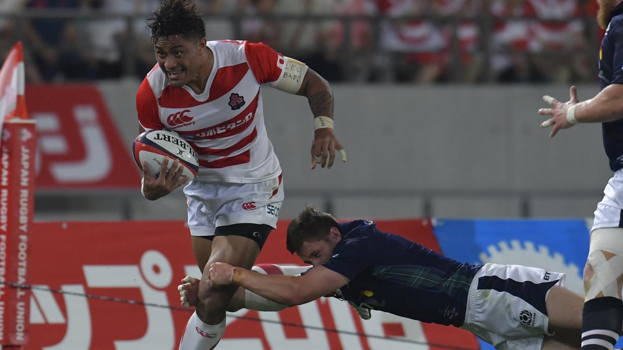 Amanaki Mafi runs with the ball during a match between Japan and Scotland at Ajinomoto Stadium.