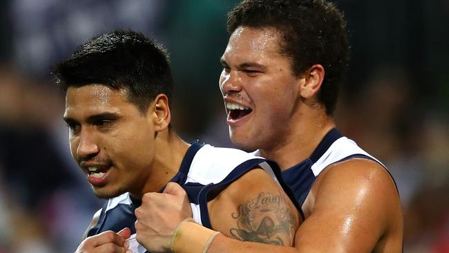 Tim Kelly is congratulated by teammate Brandan Parfitt after kicking the sealer against Sydney. Pic: Getty Images