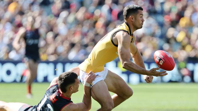 Billy Stretch from is tackled by Billy Cootee during the SANFL Grand Final. Picture: David Mariuz