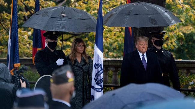 US First Lady Melania Trump and President Donald Trump at a wreath laying ceremony at the Tomb of the Unknown Soldier for Veterans Day at Arlington’s National Cemetery in Virginia on November 11. Picture: AFP