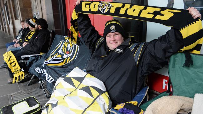 Richmond fan Kirsty Upjohn is rugged up and ready to score tickets. Picture: Lawrence Pinder