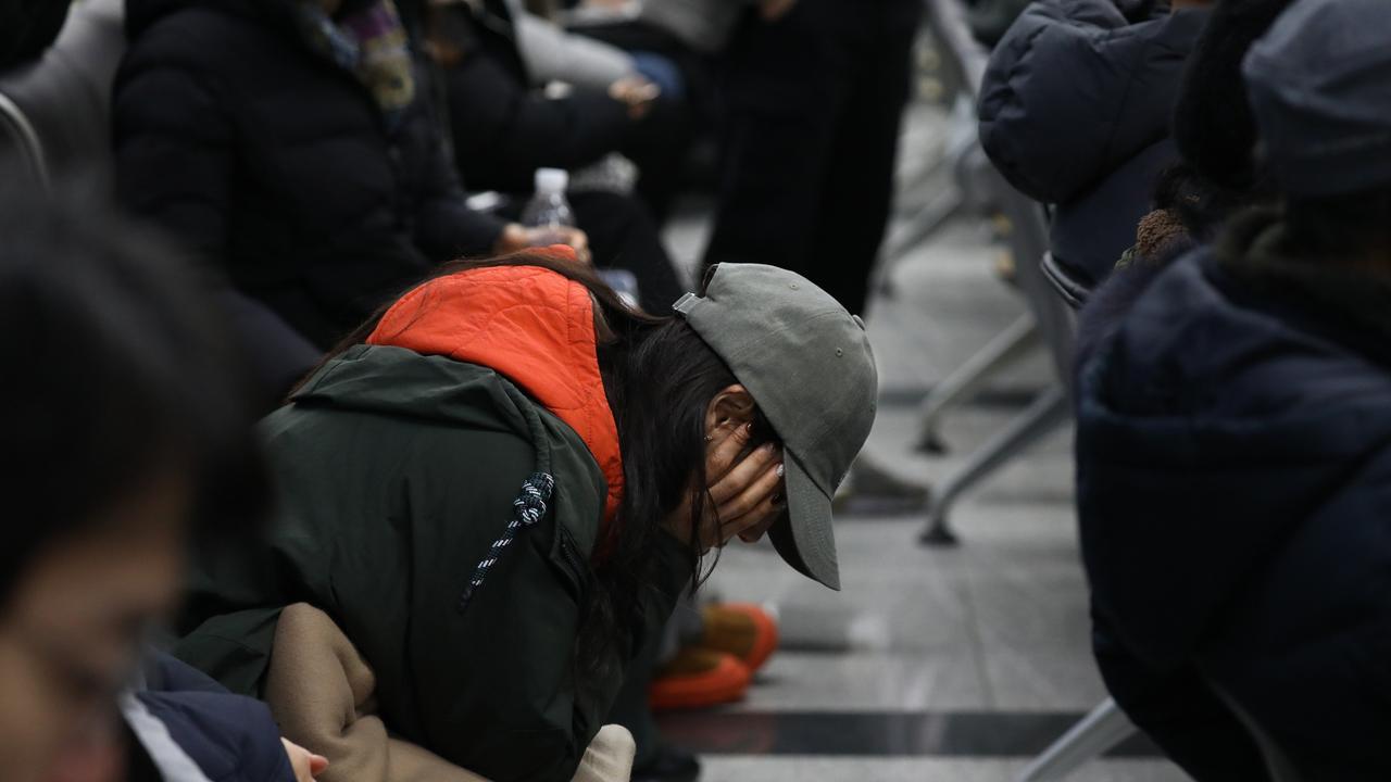 Family members are reportedly agitated at the airport demanding to know what has happened to their loved ones. Picture: Chung Sung-Jun/Getty Images