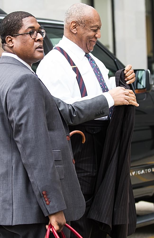 Mr Cosby carried a walking stick and smiled as he slowly put on his coat before walking into Montgomery County Court. Picture: MEGA TheMegaAgency.com