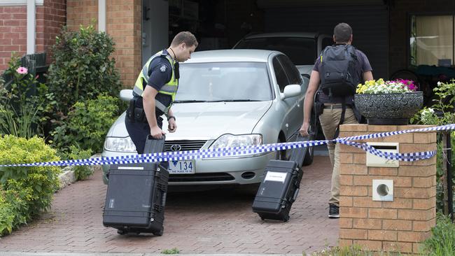 Police and detectives arrive at the Mill Park home. Picture: Sarah Matray