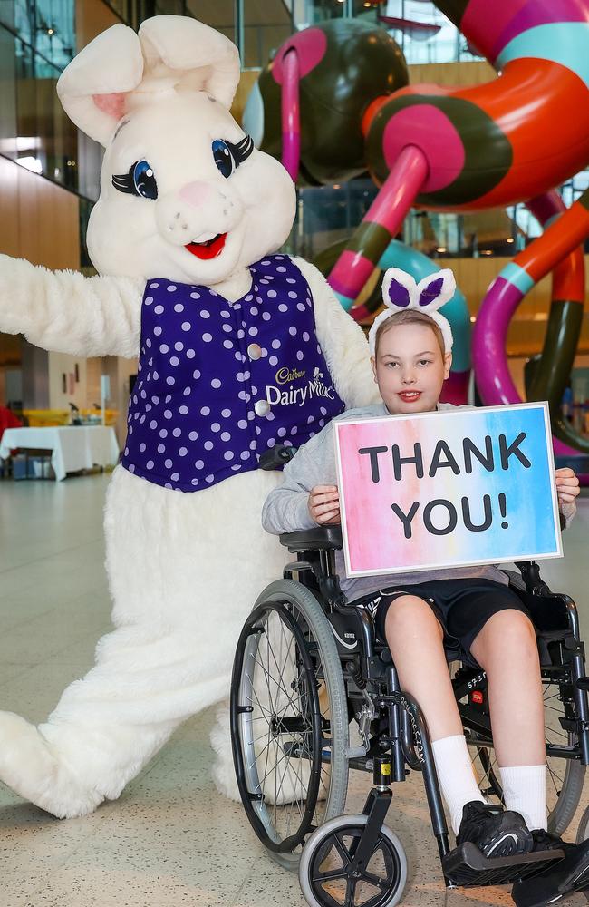 Maddison Arthur, 11, with the Easter Bunny. Picture: Ian Currie