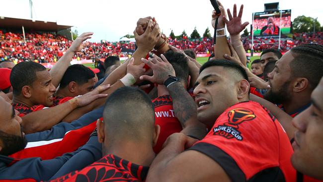 Tonga celebrate their historic win over New Zealand.