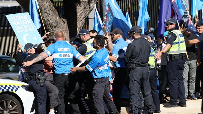 Police with anti-China protesters outside the consulate in Adelaide in 2021. Picture: NCA NewsWire / David Mariuz