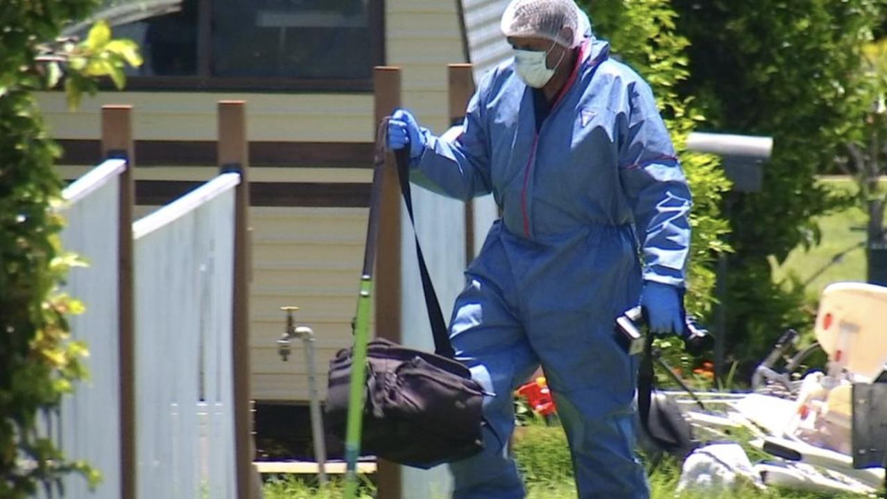 A police forensic officer at the North Mackay address after the death of a two-year-old girl. Credit: 7NEWS