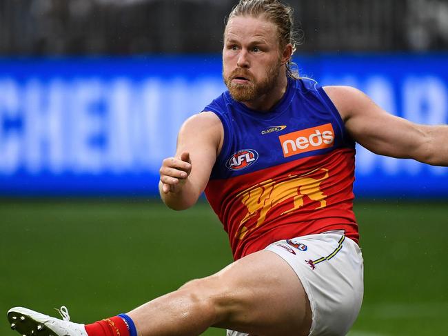 PERTH, AUSTRALIA - AUGUST 08: Daniel Rich of the Lions kicks the ball during the 2021 AFL Round 21 match between the Fremantle Dockers and the Brisbane Lions at Optus Stadium on August 8, 2021 in Perth, Australia. (Photo by Daniel Carson/AFL Photos via Getty Images)