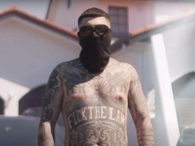 While he covered his face, Jesse Marrogi’s tattoo identifies him. Picture: Screenshot/YouTube