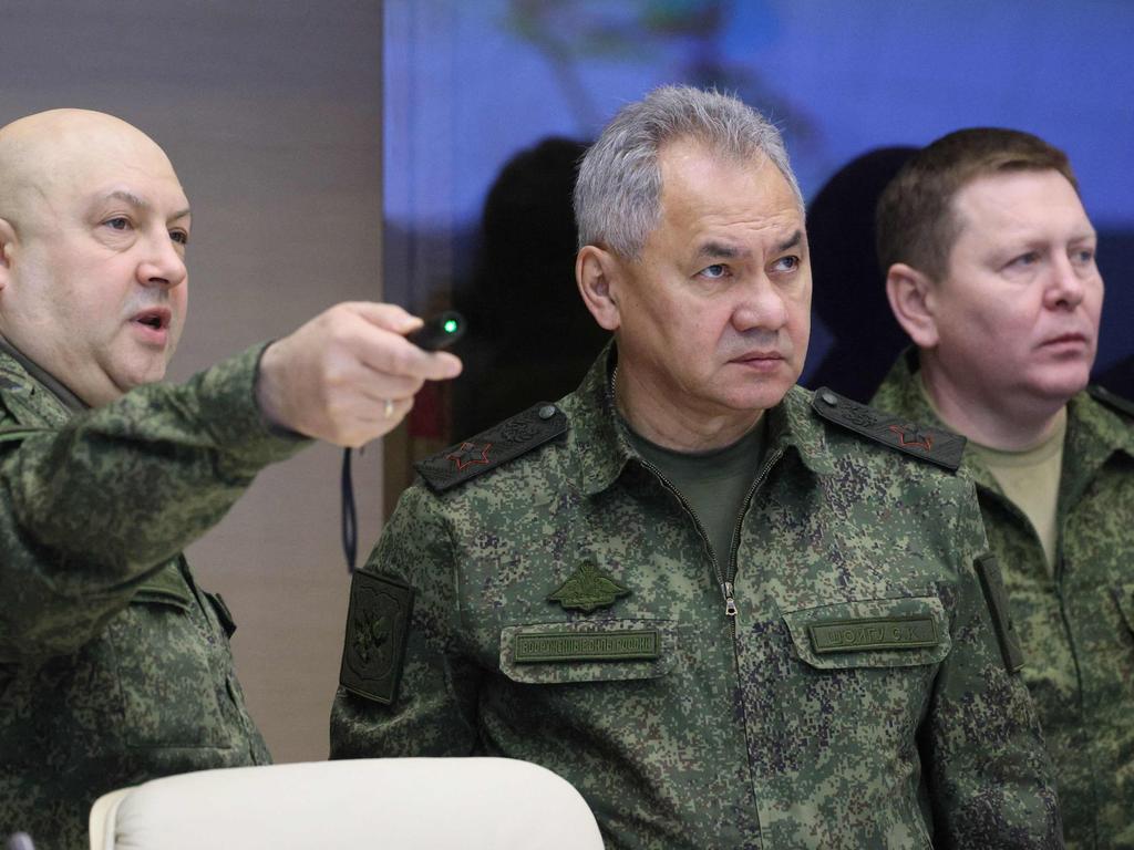 Sergei Shoigu, centre, on a visit to Ukraine. Picture: Gavriil Grigorov/Sputnik/AFP