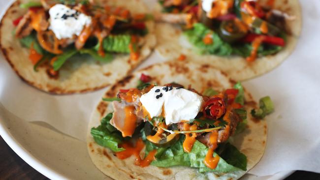 Tacos Chicken Tikka from Sacred Bites featuring shredded Chicken Tikka, crunchy lettuce, coriander, a dollop of yoghurt and a sprinkle of chilli. Picture: NIKKI DAVIS-JONES