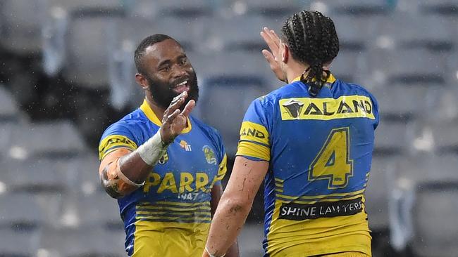 Semi Radradra celebrates a try with Eels teammate Brad Takairangi.