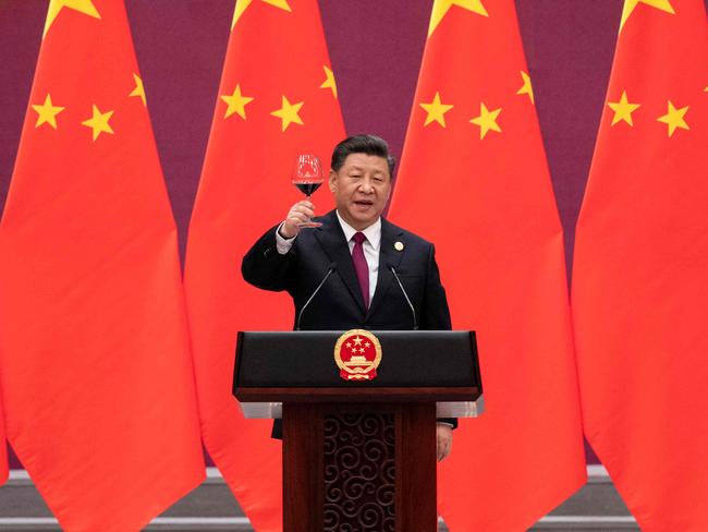 (FILES) In this file photo China's President Xi Jinping raises his glass and proposes a toast at the end of his speech during the welcome banquet for leaders attending the Belt and Road Forum at the Great Hall of the People in Beijing on April 26, 2019. - The global infrastructure plan announced by G7 leaders aims to offer developing nations a credible alternative to China's much-criticized Belt and Road Initiative -- but it faces major hurdles on the ground, especially if Beijing's hiccups are any indication.  US President Joe Biden was able to convince the G7 to sign onto the initiative, drawing allies into Washington's strategic rivalry with Beijing, under a plan titled "Build Back Better World" (B3W) that aims to provide hundreds of billions in infrastructure investment to developing nations. (Photo by Nicolas ASFOURI and NICOLAS ASFOURI / POOL / AFP)