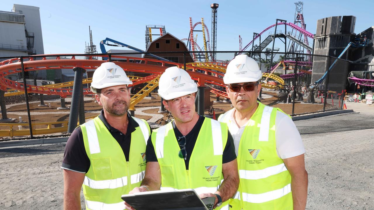 Project Manager Matt Marwood, Village roadshow CEO Clark Kirby, and COO Bikash Randhawa look over construction of the Wizard of Oz Precinct at Movie World. Picture Glenn Hampson