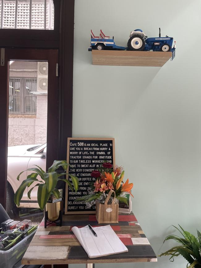 Tractors made of rubber thongs from India sit on a few shelves in the cafe. Picture: Niki Iliagoueva