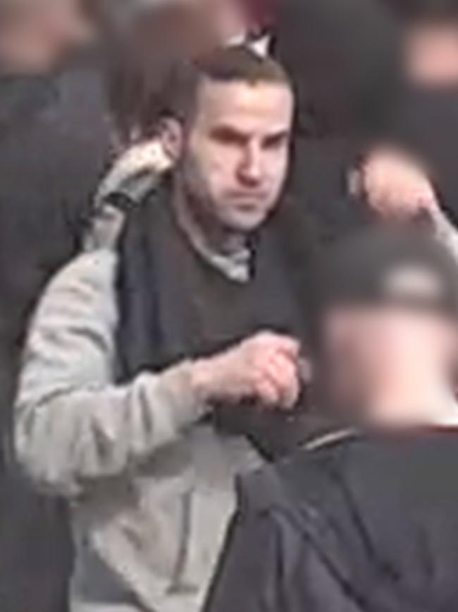 One of the men was wearing a grey jumper at the time.