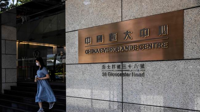 A woman leaves the China Evergrande Centre in Hong Kong. Picture: AFP