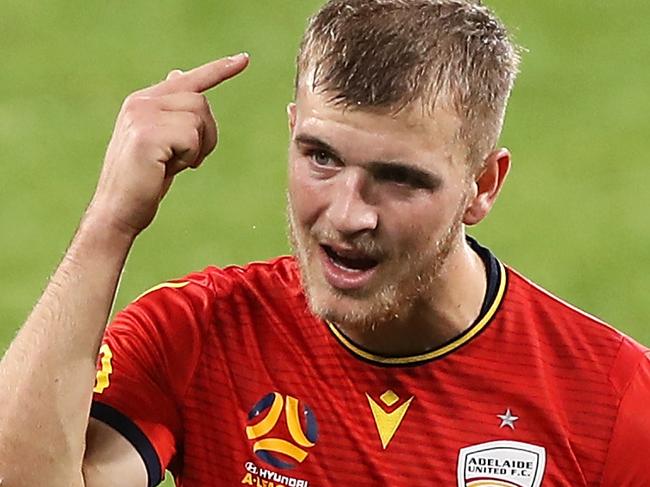 SYDNEY, AUSTRALIA - JULY 25: Riley McGree of United gestures to Mohamed TourÃÂ© of United after he fouled Reno Piscopo of the Phoenix leading to a penalty spot kick during the round 26 A-League match between the Wellington Phoenix and Adelaide United at Bankwest Stadium on July 25, 2020 in Sydney, Australia. (Photo by Mark Kolbe/Getty Images)